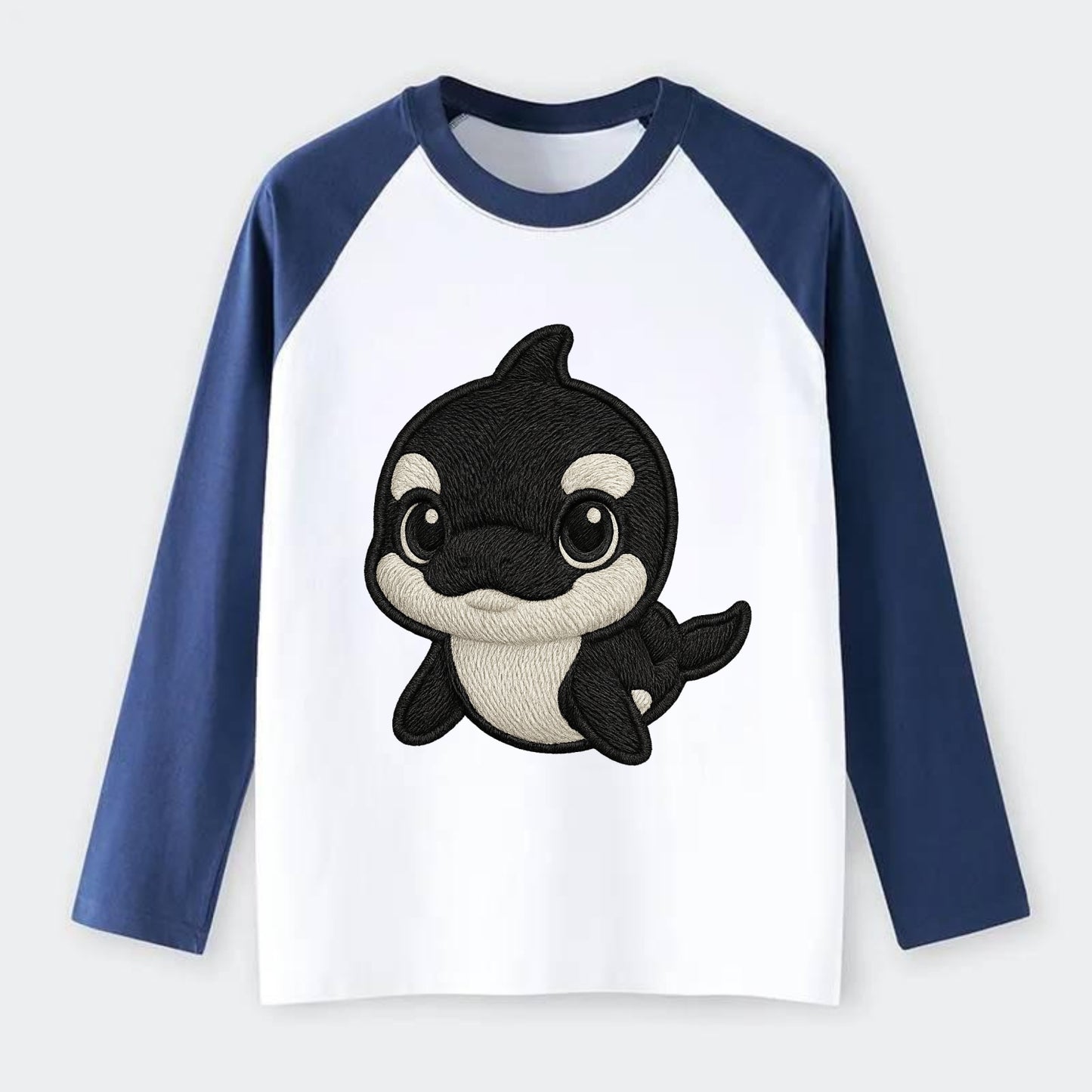 Baby Orca - black and white pattern, white eye patch, front-facing, - Raglan Long Sleeve T-Shirt - Blue
