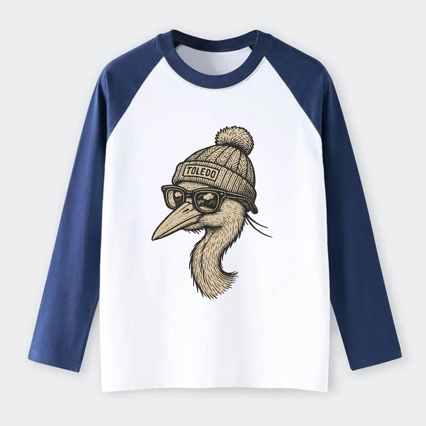 Toledo Great Blue Heron wearing Toledo beanie with pom pom and - Raglan Long Sleeve T-Shirt - Blue