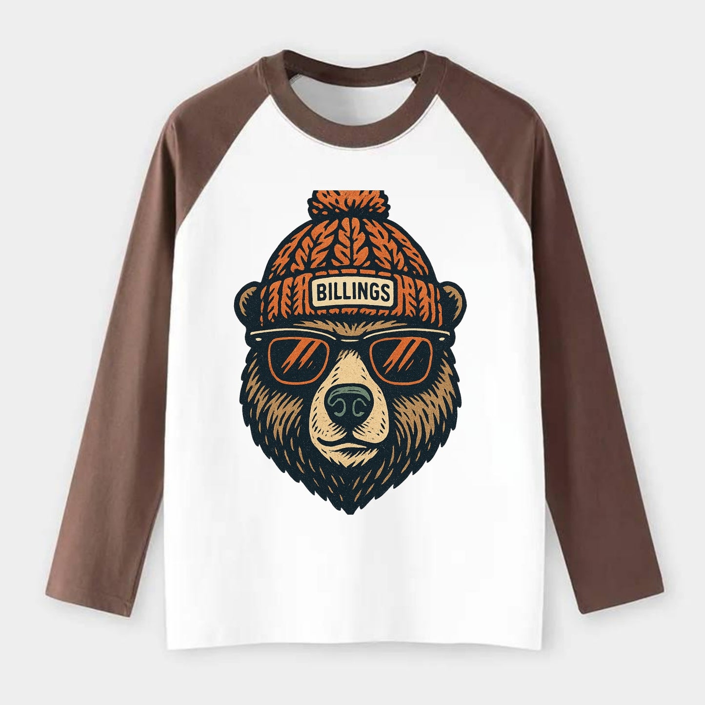 Montana Grizzly Bear wearing Billings beanie with pom pom and wayfarer - Raglan Long Sleeve T-Shirt - Coffee