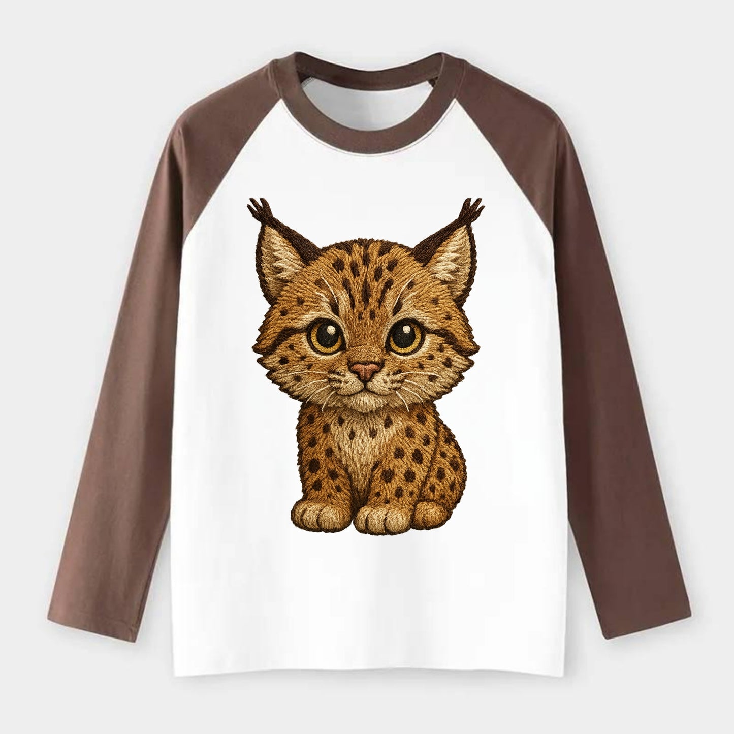 Baby Lynx Cub - tufted ears, spotted fur, golden eyes, front-facing, - Raglan Long Sleeve T-Shirt - Coffee