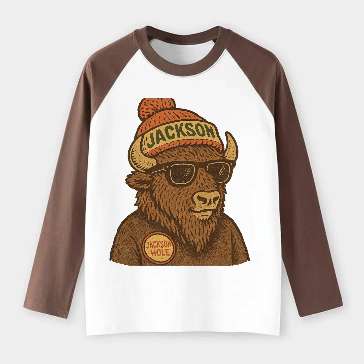 Jackson Hole Bison wearing Jackson beanie with pom pom and wayfarer - Raglan Long Sleeve T-Shirt - Coffee