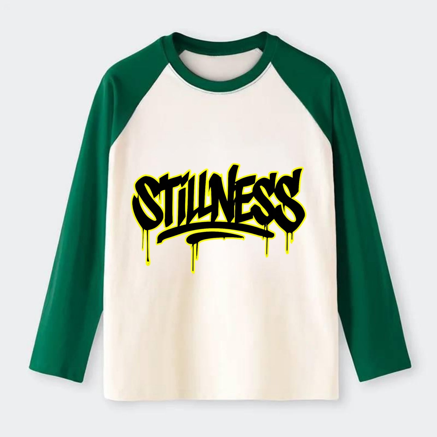 Bold typography design - "STILLNESS" - quiet power, peaceful presence - Raglan Long Sleeve T-Shirt - Green