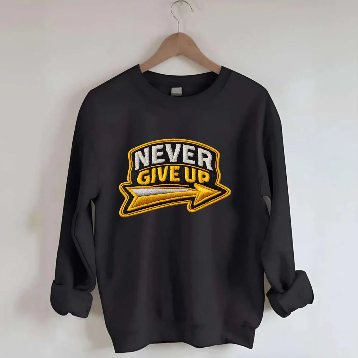 NEVER GIVE UP - bold text with arrow in gold , determination - Crewneck Sweatshirt - black