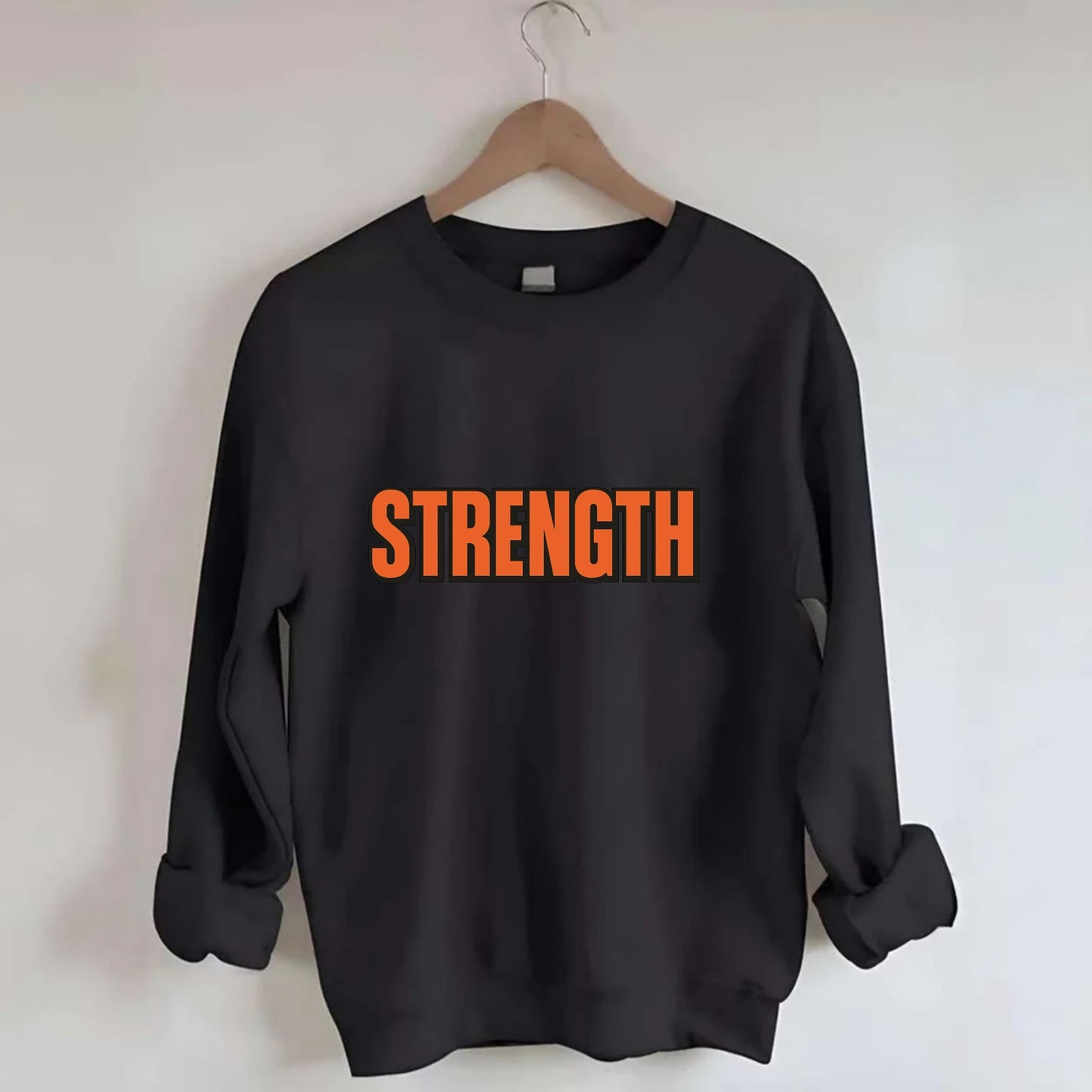 Bold typography design - "STRENGTH" - inner power, resilience, fortitude - Crewneck Sweatshirt - black