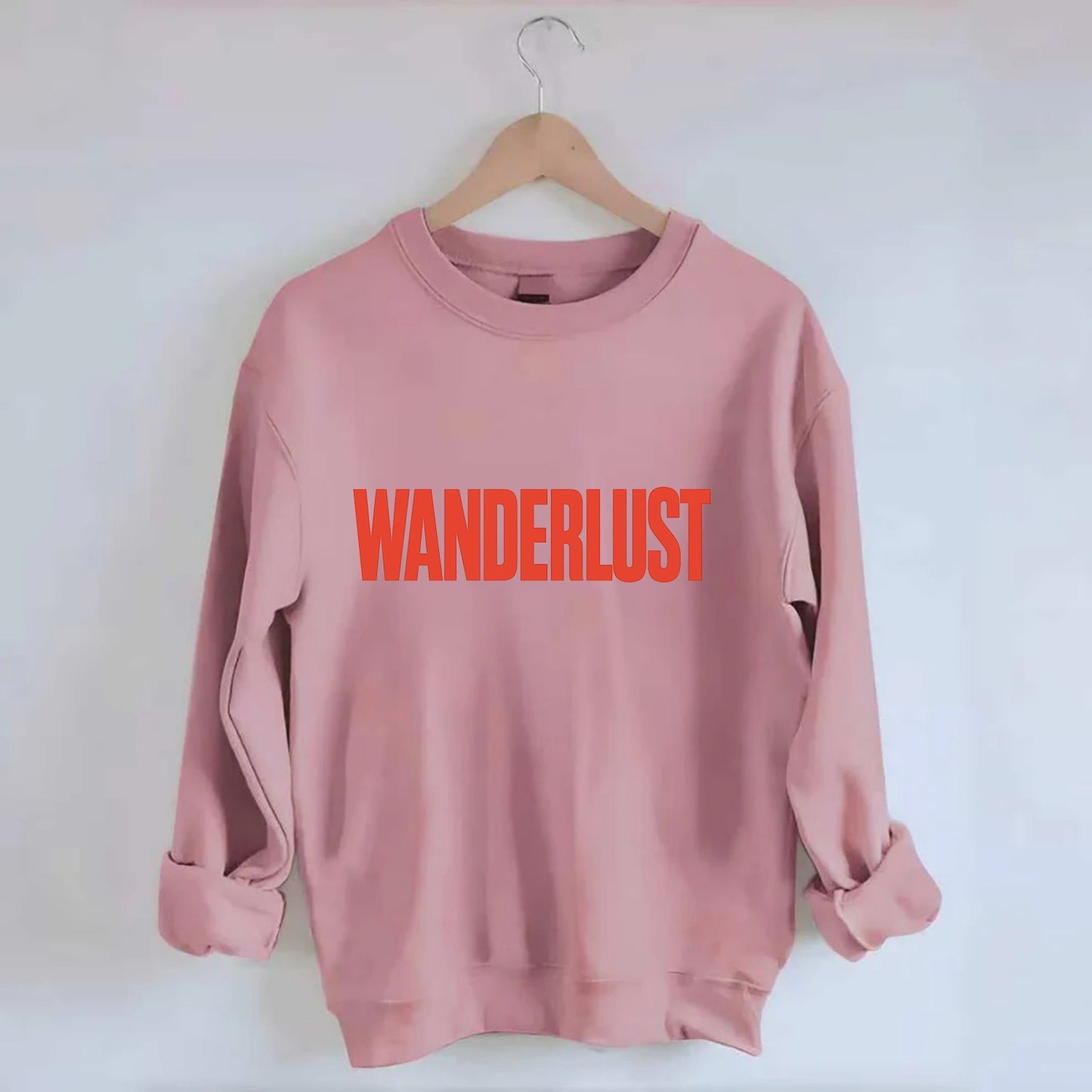 Bold typography design - "WANDERLUST" - desire to travel, explore the world - Crewneck Sweatshirt - pink