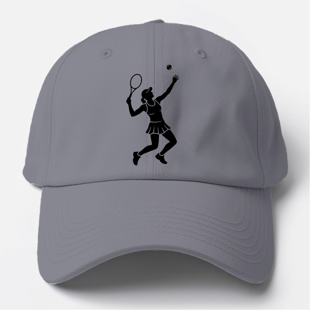 Tennis player serving powerful shot Baseball Cap