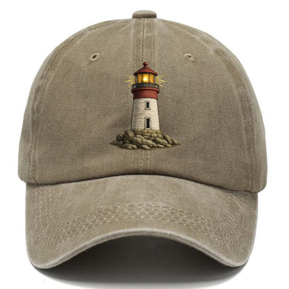 illuminated lighthouse on a rocky shore Hat