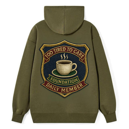 Crest with coffee cup - "Too Tired To Care Foundation - Daily Member" - - Classic Pullover Hoodie - ArmyGreen