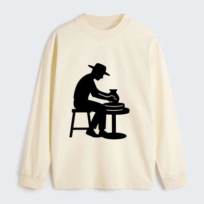 Potter shaping clay on wheel - Classic Long Sleeve Shirt - Beige