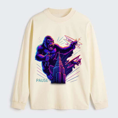 giant gorilla on top of skyscraper holding small figure, swatting planes - Classic Long Sleeve Shirt - Beige