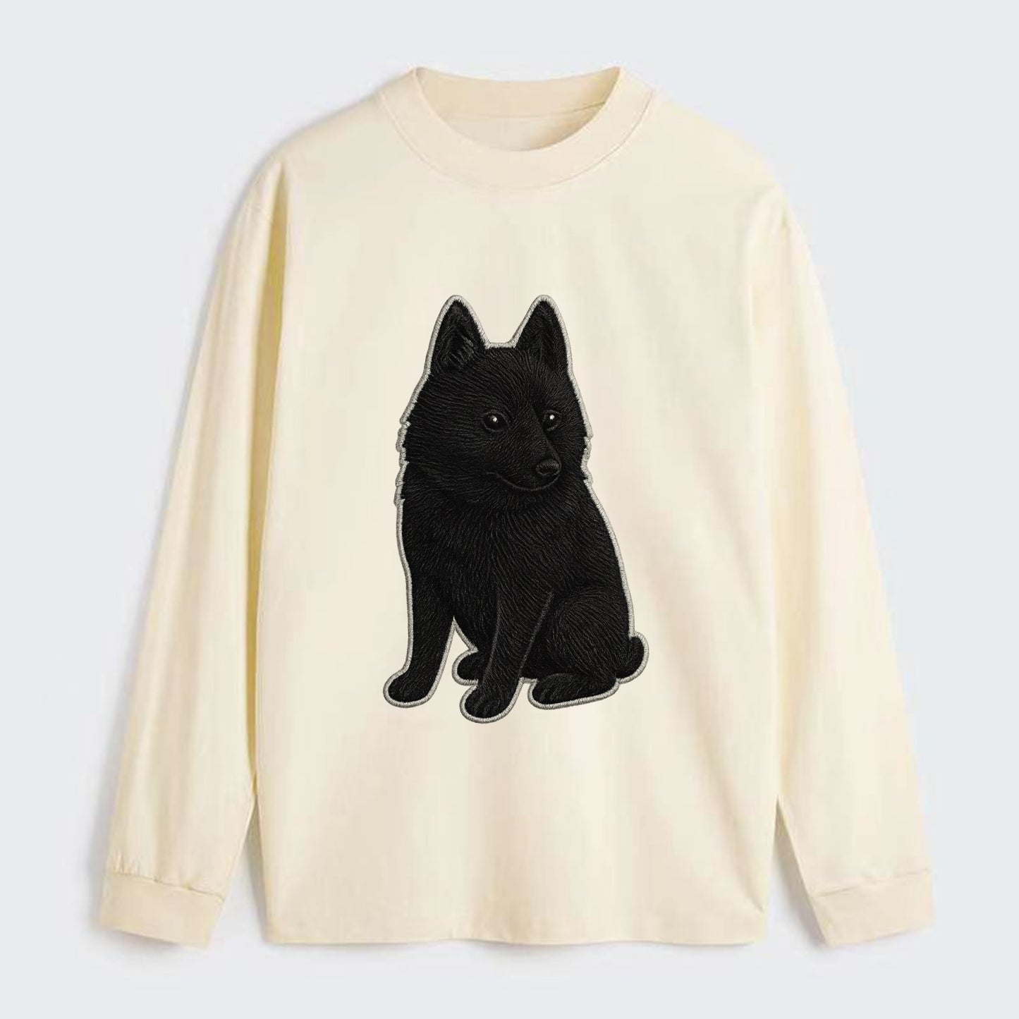 Schipperke - Solid black small embroidered sitting pose - Classic Long Sleeve Shirt - Beige