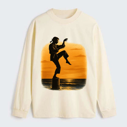 karate crane kick pose on wooden post at beach sunset - Classic Long Sleeve Shirt - Beige