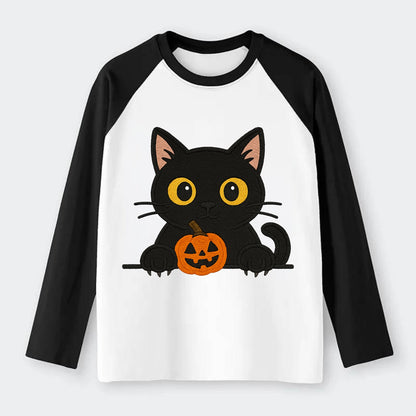 Midnight the black cat wearing round spectacles while studying the - Raglan Long Sleeve T-Shirt - Black