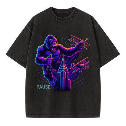 giant gorilla on top of skyscraper holding small figure, swatting planes - Vintage T-shirt - Black