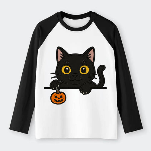 Midnight the black cat poking tongue out playfully while peeking. - Raglan Long Sleeve T-Shirt