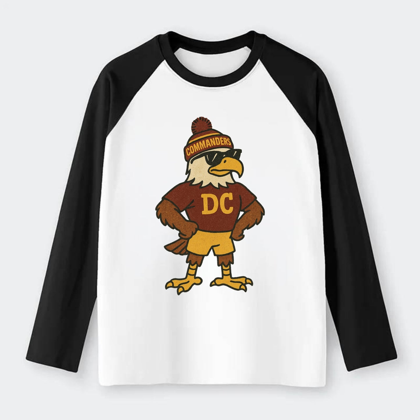 DC Eagle wearing Commanders burgundy and gold beanie with pom pom and - Raglan Long Sleeve T-Shirt - Black