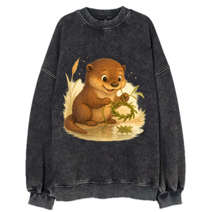 Otter weaving river reeds into a floating crown beside mirror-still water - Vintage Sweatshirt - Black