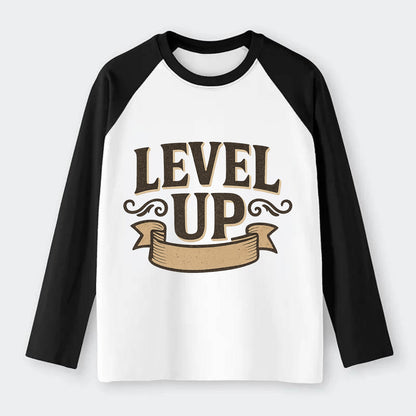 Bold typography design - "LEVEL UP" - improving, advancing, growing - Raglan Long Sleeve T-Shirt - Black
