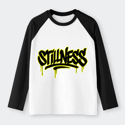 Bold typography design - "STILLNESS" - quiet power, peaceful presence - Raglan Long Sleeve T-Shirt - Black