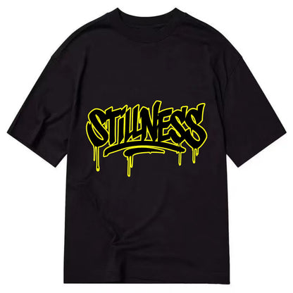 Bold typography design - "STILLNESS" - quiet power, peaceful presence - Classic T-shirt - Black