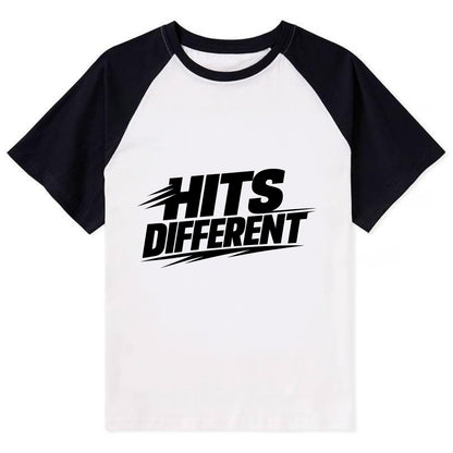 Bold typography design - "HITS DIFFERENT" - uniquely special, stands out - Contrast Raglan T-shirt - Black