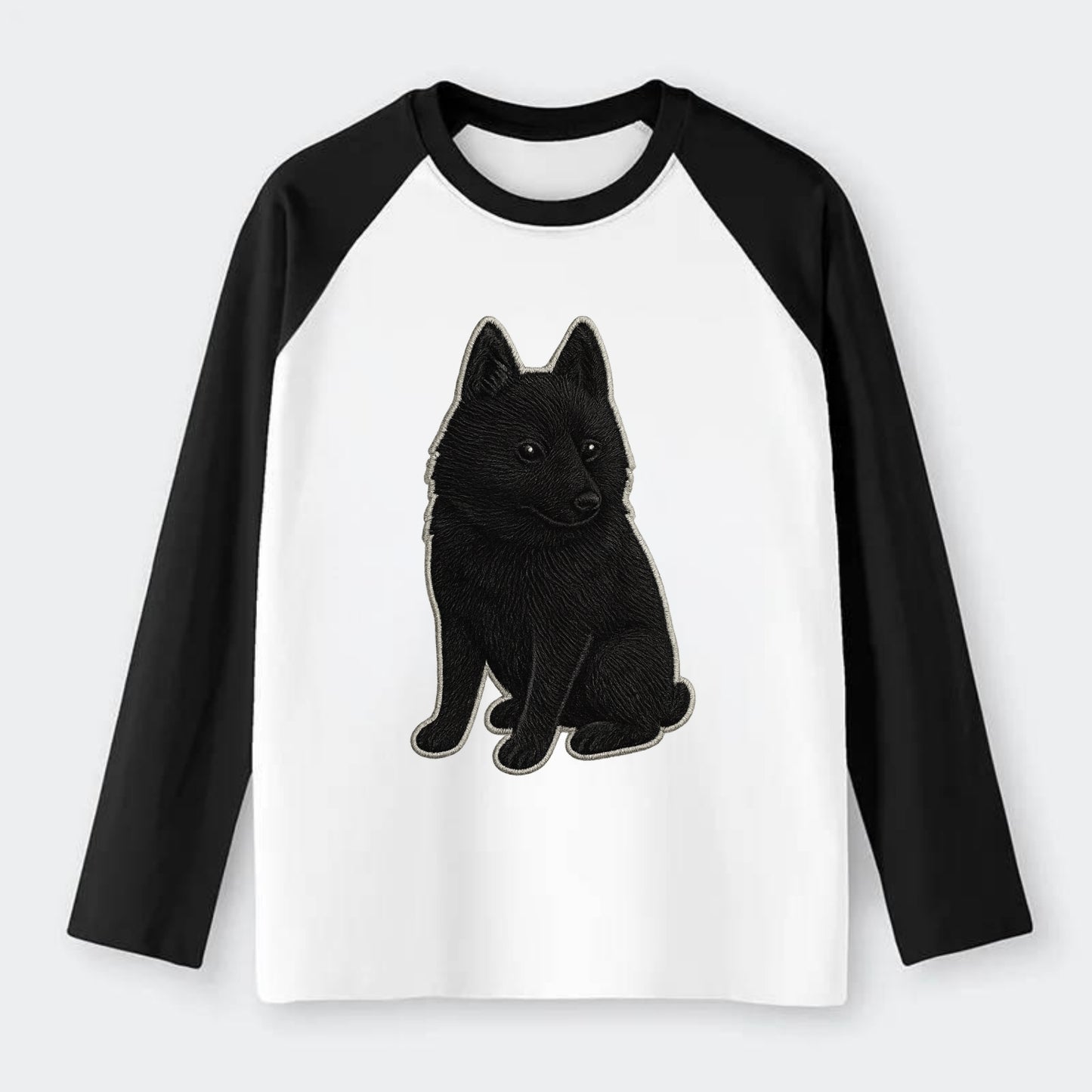 Schipperke - Solid black small embroidered sitting pose - Raglan Long Sleeve T-Shirt - Black