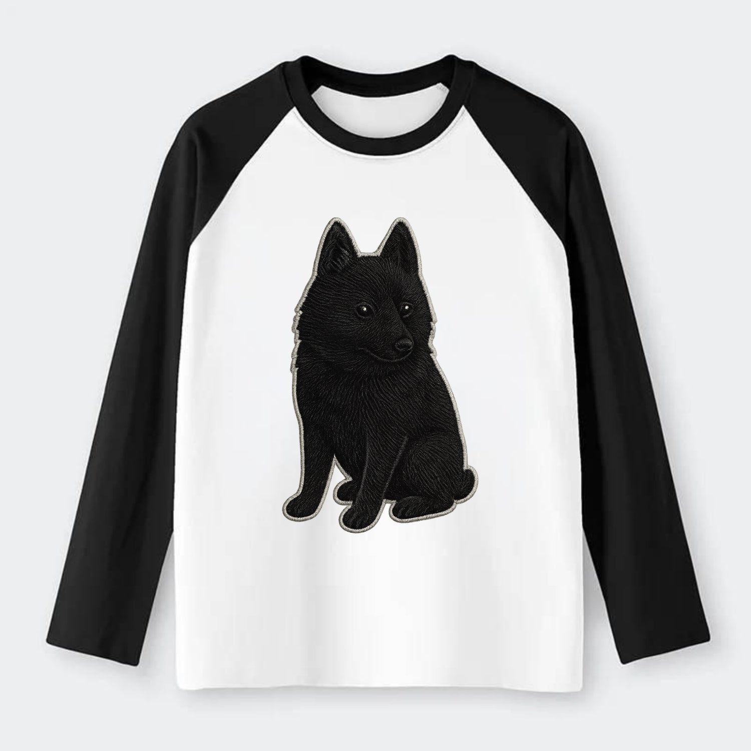 Schipperke - Solid black small embroidered sitting pose - Raglan Long Sleeve T-Shirt - Black
