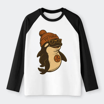 Victoria Orca wearing Victoria beanie with pom pom and wayfarer - Raglan Long Sleeve T-Shirt - Black