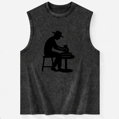 Potter shaping clay on wheel - Vintage Washed Tank - Black