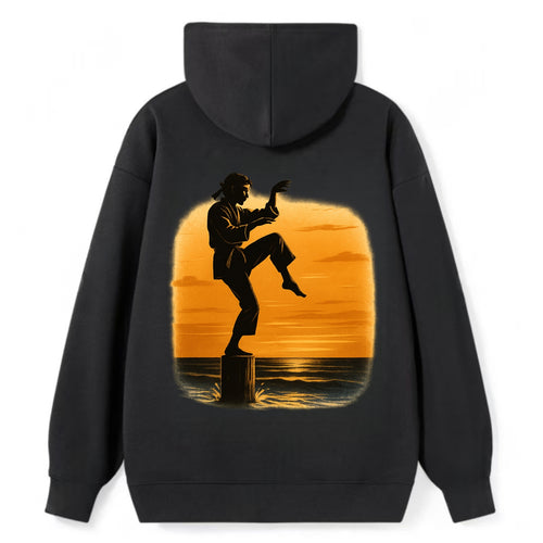 karate crane kick pose on wooden post at beach sunset - Classic Pullover Hoodie