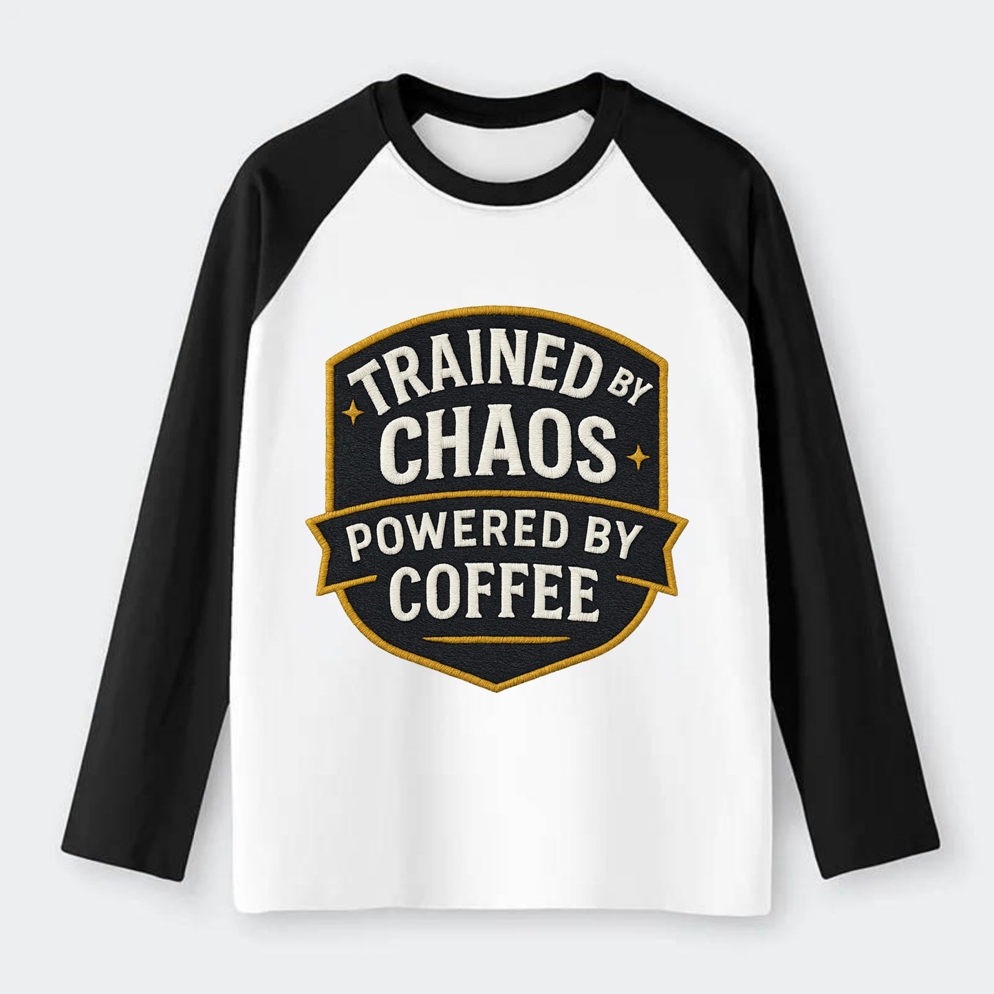 Trained by chaos, powered by coffee - Raglan Long Sleeve T-Shirt - Black