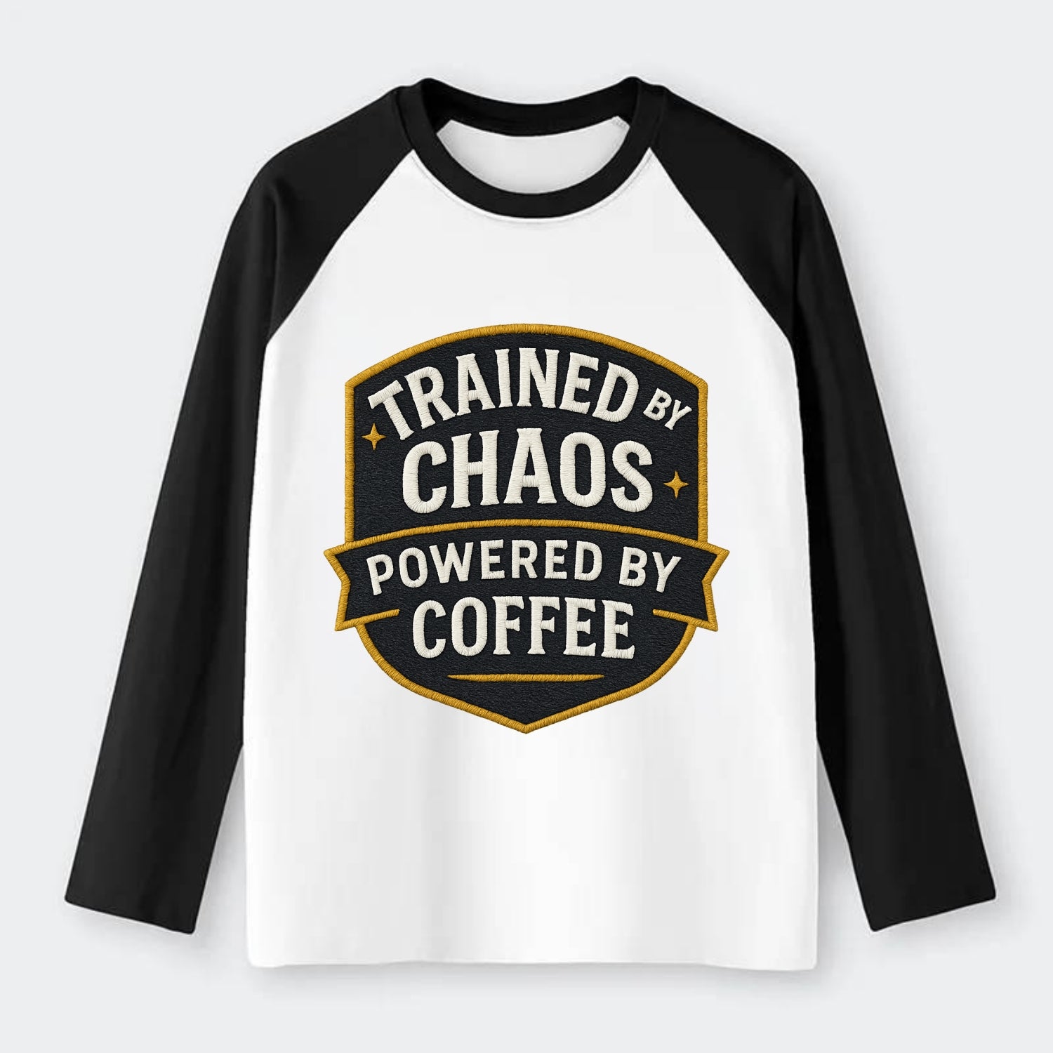 Trained by chaos, powered by coffee - Raglan Long Sleeve T-Shirt - Black