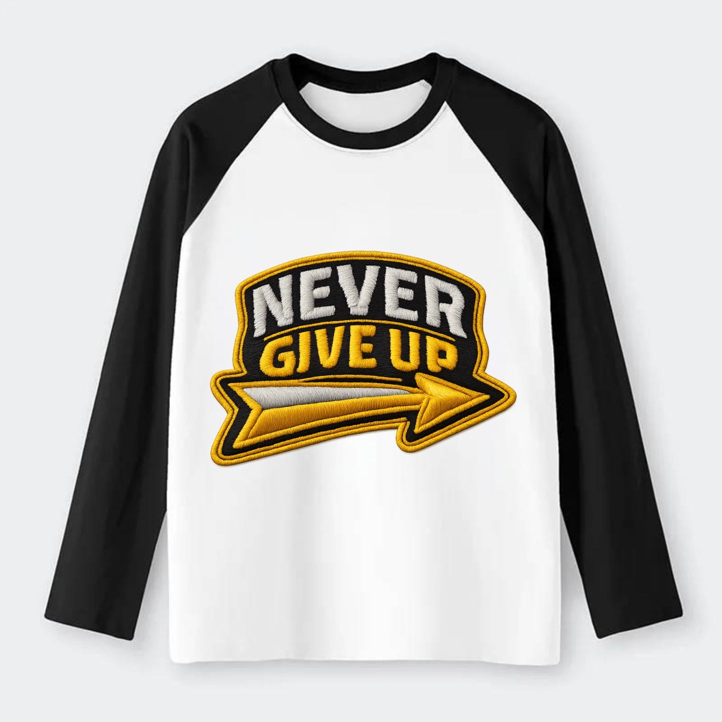 NEVER GIVE UP - bold text with arrow in gold , determination - Raglan Long Sleeve T-Shirt - Black