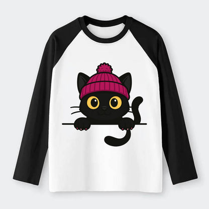 Midnight the black cat holding a tiny book labeled secrets against the - Raglan Long Sleeve T-Shirt - Black