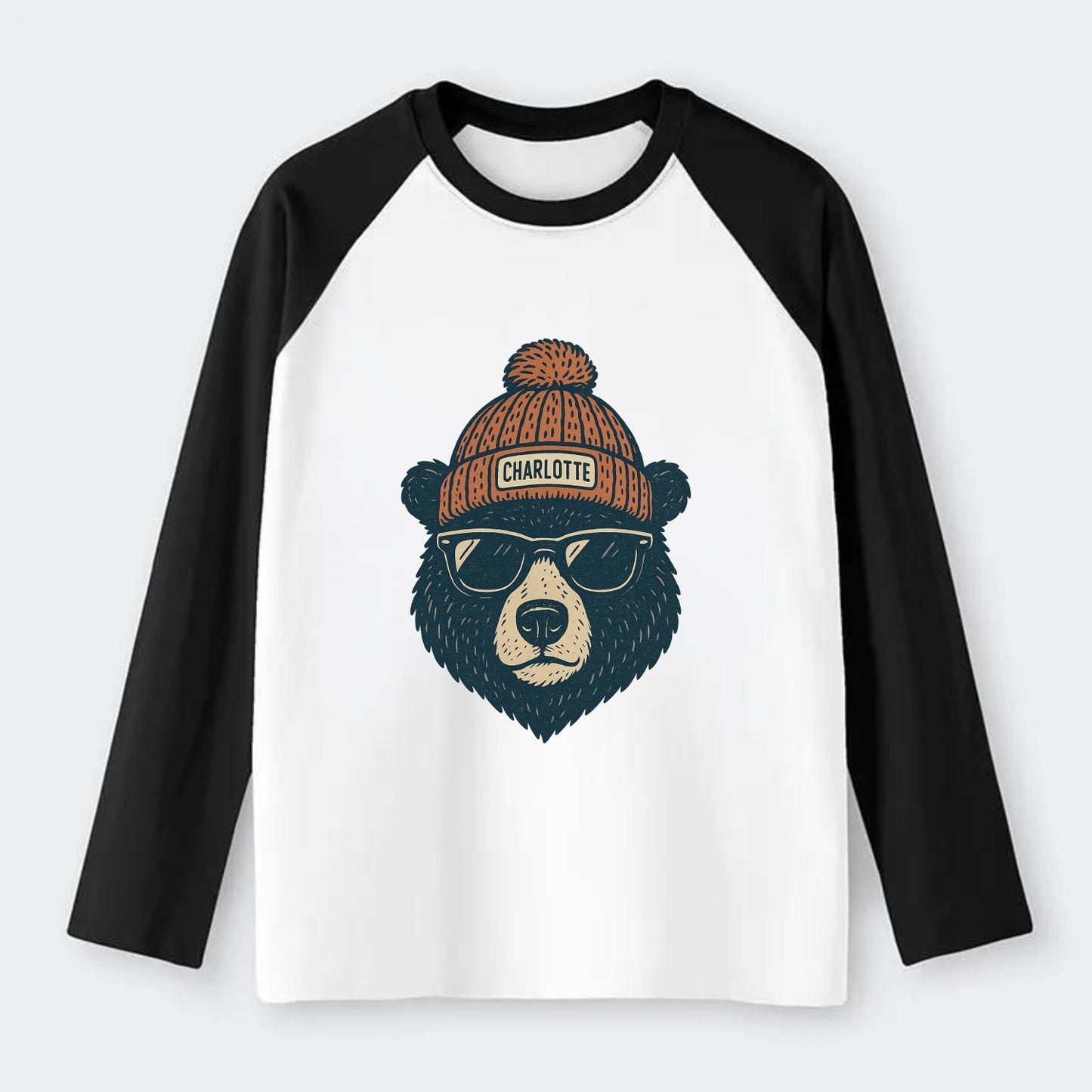 North Carolina Black Bear wearing Charlotte beanie with pom pom and - Raglan Long Sleeve T-Shirt - Black