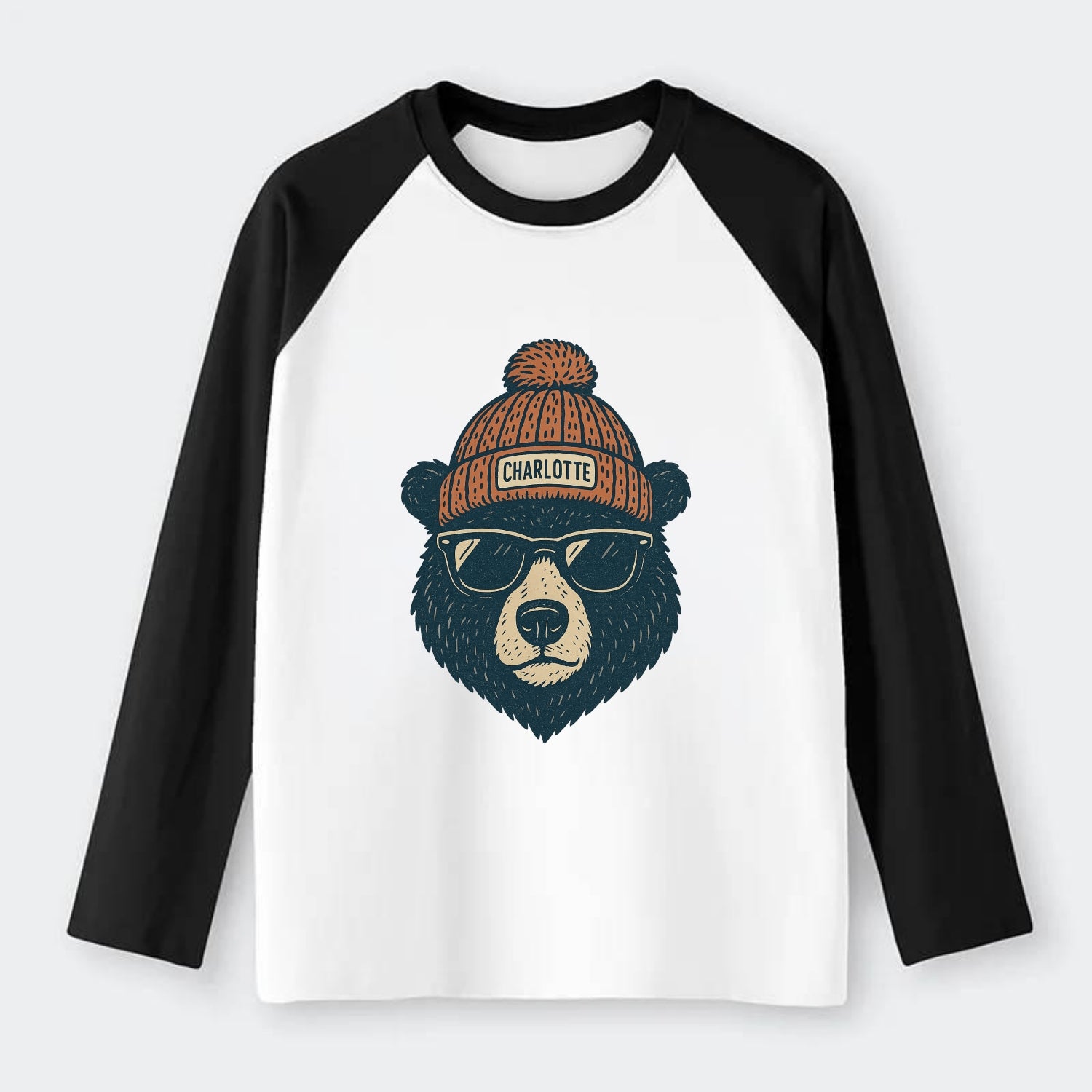 North Carolina Black Bear wearing Charlotte beanie with pom pom and - Raglan Long Sleeve T-Shirt - Black