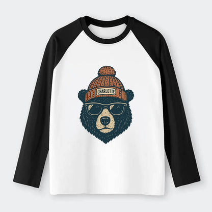 North Carolina Black Bear wearing Charlotte beanie with pom pom and - Raglan Long Sleeve T-Shirt - Black