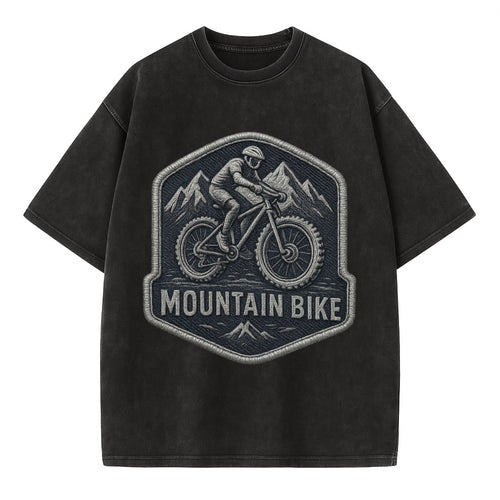 Mountain bike with rugged tires - cyclist badge - Vintage T-shirt