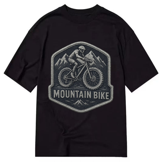 Mountain bike with rugged tires - cyclist badge - Classic T-shirt - Black