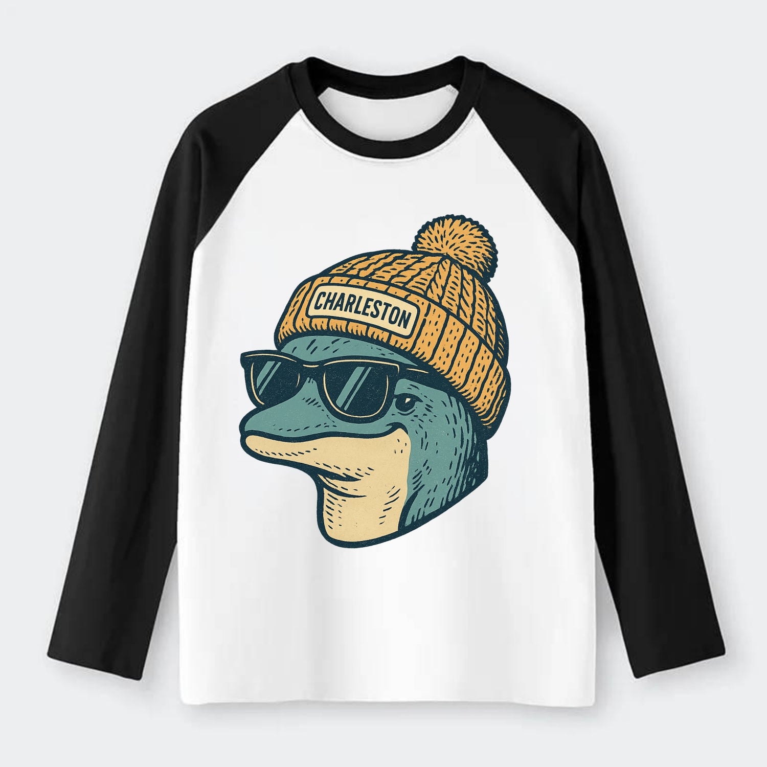 Charleston Dolphin wearing Charleston beanie with pom pom and wayfarer - Raglan Long Sleeve T-Shirt - Black