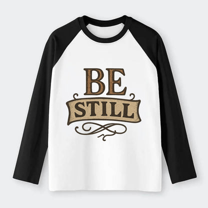 Bold typography design - "BE STILL" - quiet mind, meditation, inner - Raglan Long Sleeve T-Shirt - Black