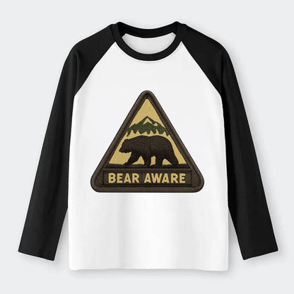 BEAR AWARE - bear silhouette warning in brown and yellow , wilderness - Raglan Long Sleeve T-Shirt - Black