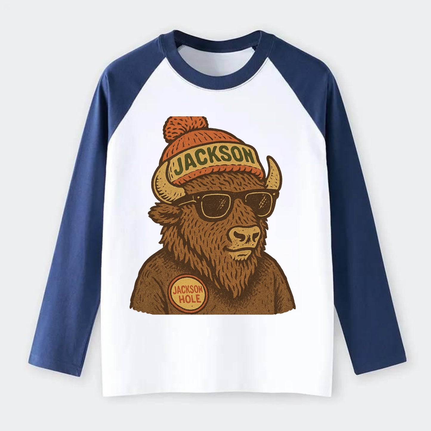 Jackson Hole Bison wearing Jackson beanie with pom pom and wayfarer - Raglan Long Sleeve T-Shirt - Blue