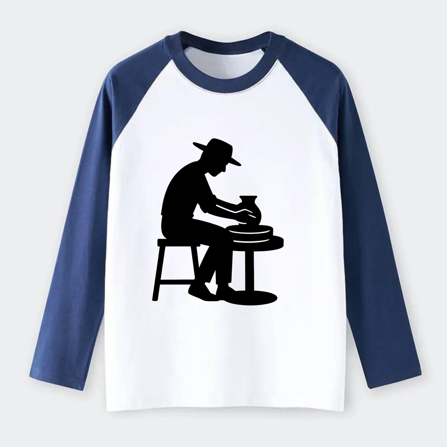Potter shaping clay on wheel - Raglan Long Sleeve T-Shirt - Blue