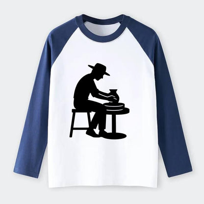 Potter shaping clay on wheel - Raglan Long Sleeve T-Shirt - Blue