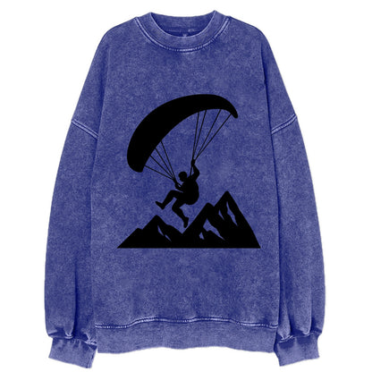 Paraglider soaring over mountain peaks - Vintage Sweatshirt - Blue