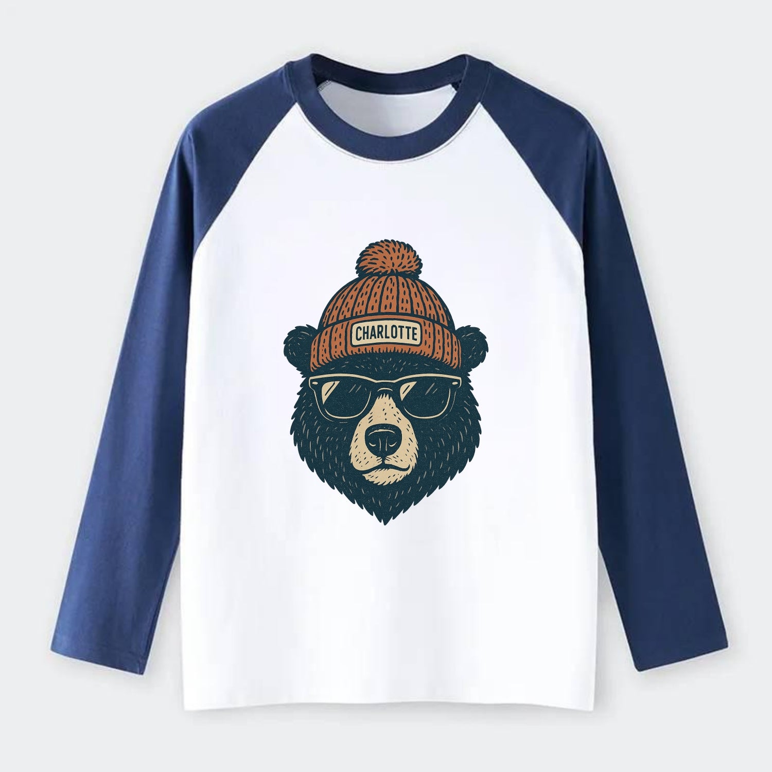 North Carolina Black Bear wearing Charlotte beanie with pom pom and - Raglan Long Sleeve T-Shirt - Blue
