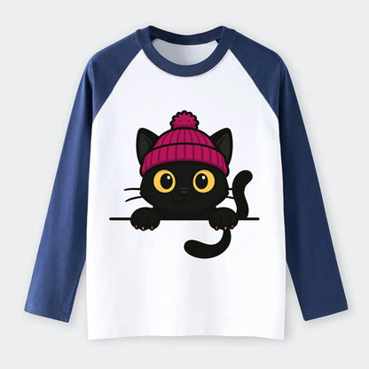 Midnight the black cat holding a tiny book labeled secrets against the - Raglan Long Sleeve T-Shirt - Blue