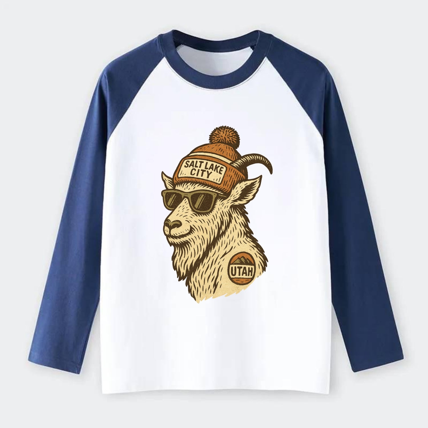 Utah Mountain Goat wearing Salt Lake City beanie with pom pom and - Raglan Long Sleeve T-Shirt - Blue