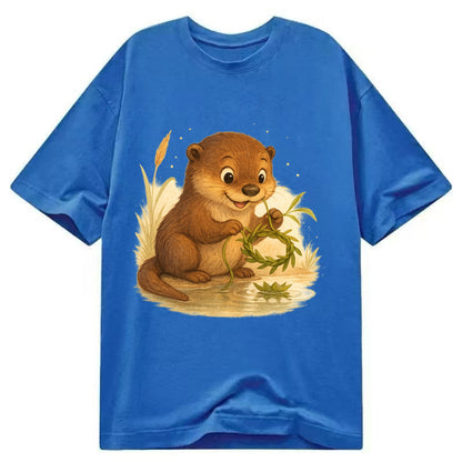 Otter weaving river reeds into a floating crown beside mirror-still water - Classic T-shirt - Blue